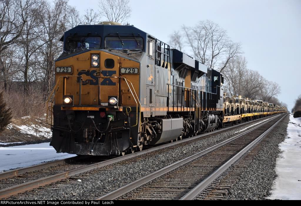 Military train rolls west